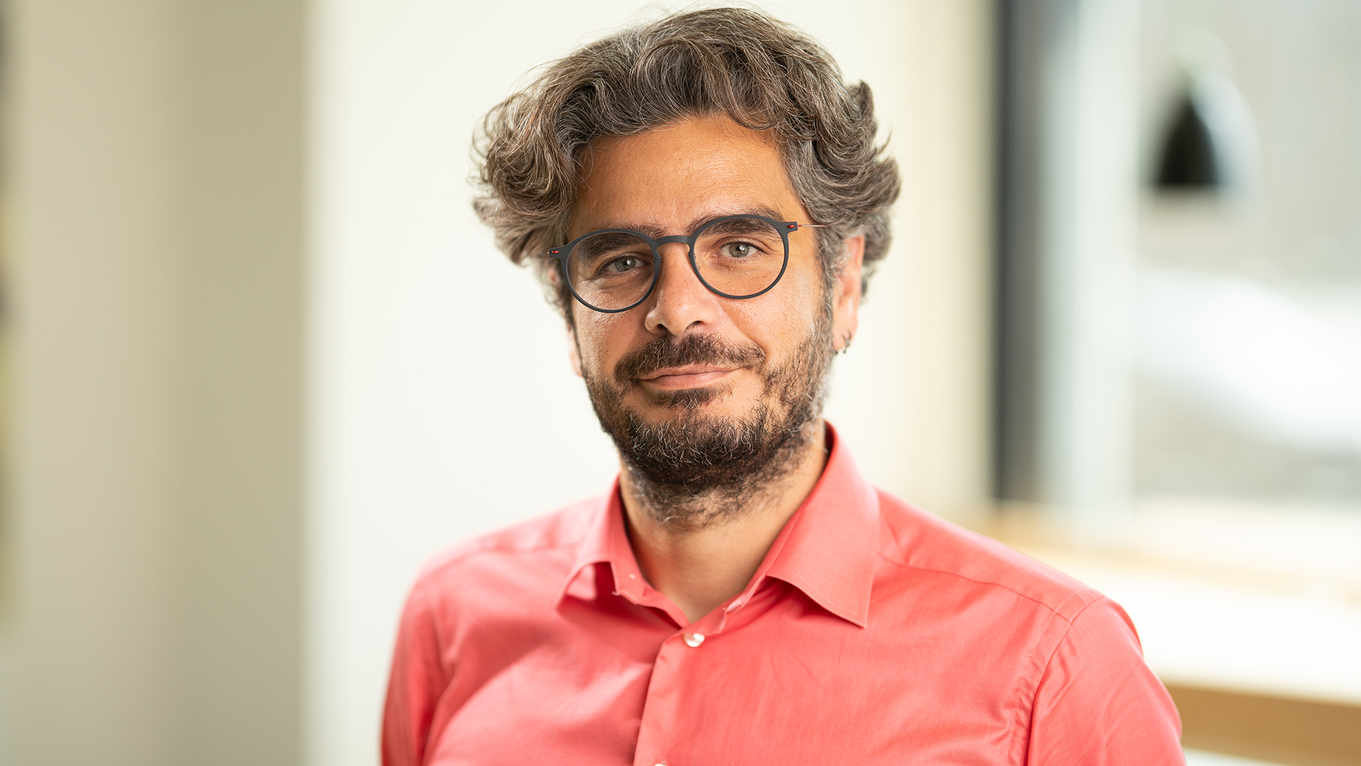 Advisory board member Ioannis wearing a salmon coloured shirt