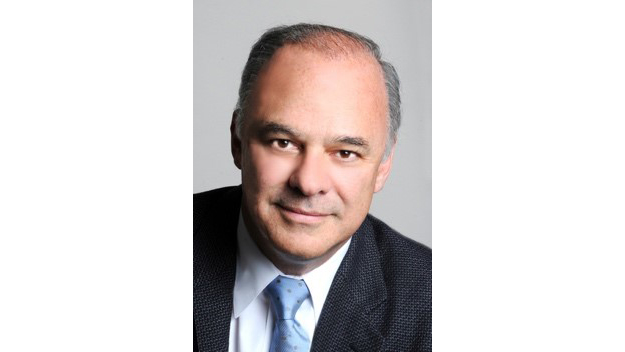 Advisory Board member Paulo wearing a suit with a light blue tie